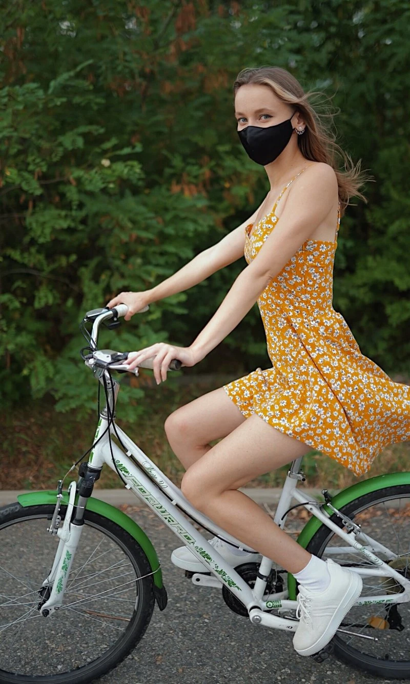 A girl rides a bike without panties