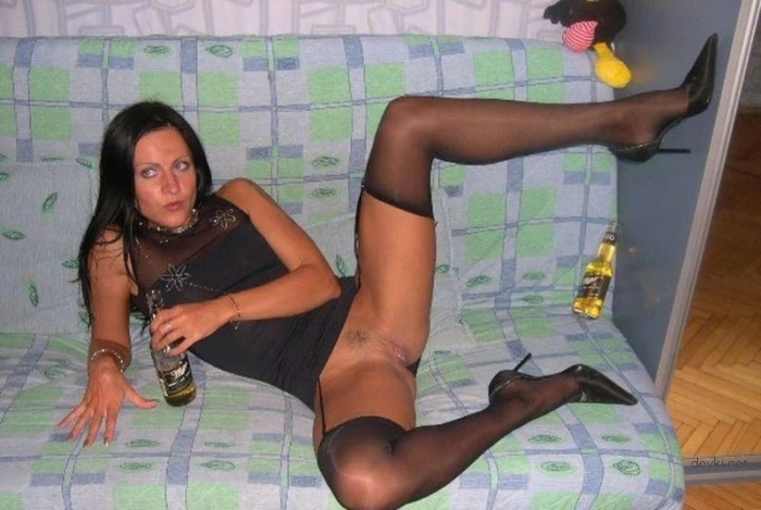 Sexy brunette fucks herself with bottles and participates in a group sex