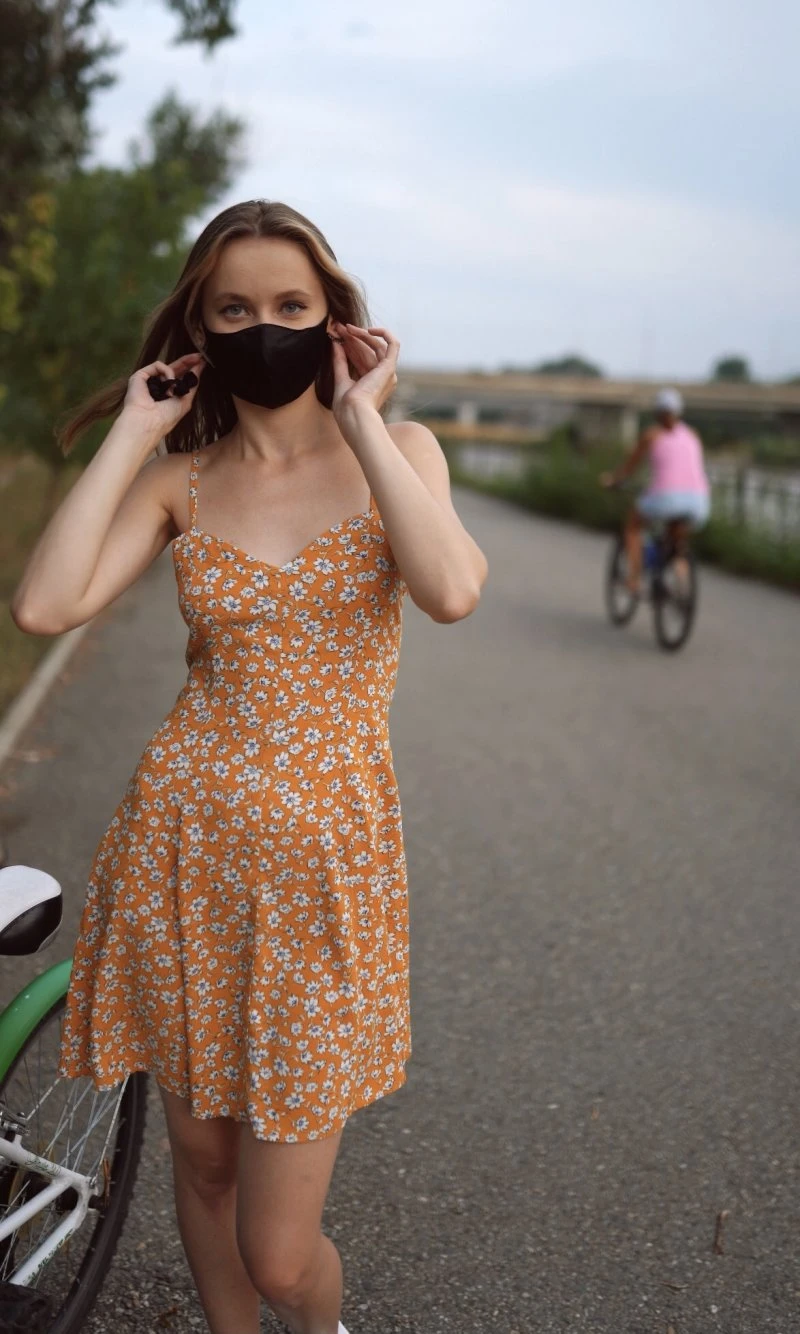 The girl rides a bike and takes off her panties